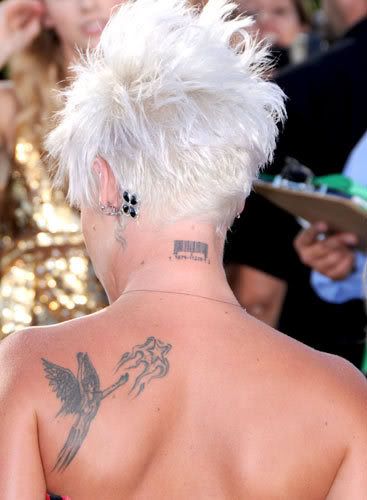  of political statement, Pink has a barcode tattooed across her neck.